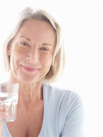 Mature woman drinking water Stock Photo - Premium Royalty-Free, Code: 649-02199757