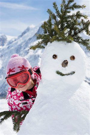 Girls with a snowman Foto de stock - Sin royalties Premium, Código: 649-02290243