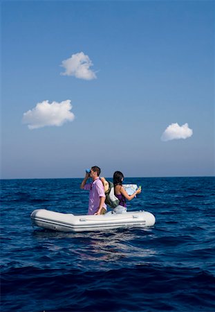 picture of woman kneeling down from behind - Couple lost at sea on little boat Stock Photo - Premium Royalty-Free, Code: 649-02290346