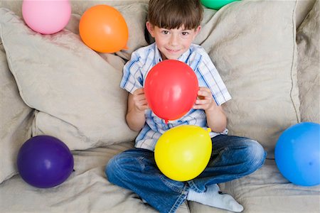 Young boy with lot of balloons Stock Photo - Premium Royalty-Free, Code: 649-02290405