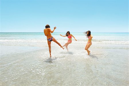 simsearch:6109-06195394,k - Three girls splashing each other Stock Photo - Premium Royalty-Free, Code: 649-02290461