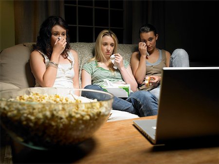 roommate - Three young women watching a movie Stock Photo - Premium Royalty-Free, Code: 649-02290635