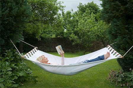 Woman relaxing in hammock in garden Stock Photo - Premium Royalty-Free, Code: 649-02290657