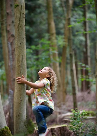 preserving - Young girl starting to climb tall tree Stock Photo - Premium Royalty-Free, Code: 649-02424026