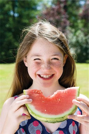Girl eating a watermelon Stock Photo - Premium Royalty-Free, Code: 649-02424064