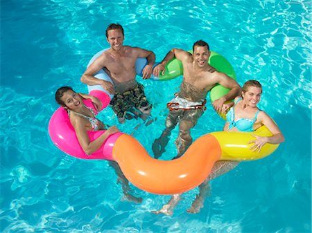 pool woman inflatable tube - Group of friends in pool Foto de stock - Sin royalties Premium, Código: 649-02424465