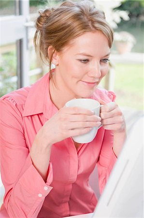 Female reading an email Stock Photo - Premium Royalty-Free, Code: 649-02423444