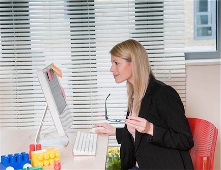 desk toy - A woman working from home Stock Photo - Premium Royalty-Free, Code: 649-02423465