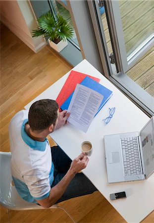 desk directly above - A man working from home Stock Photo - Premium Royalty-Free, Code: 649-02423461