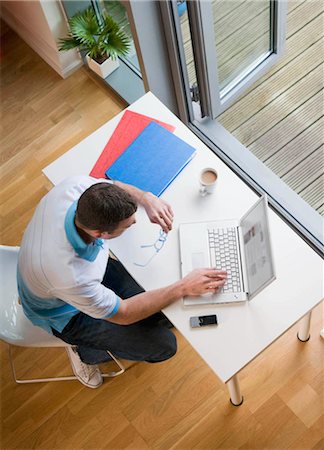 desk directly above - A man at his desk with laptop Stock Photo - Premium Royalty-Free, Code: 649-02423462