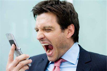 phone frustration - Man screaming at phone Stock Photo - Premium Royalty-Free, Code: 649-02423668