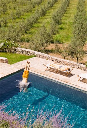 Man diving in to a pool Stock Photo - Premium Royalty-Free, Code: 649-02665947