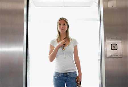 scared young woman one not man not asian - Girl in lift Stock Photo - Premium Royalty-Free, Code: 649-02665997