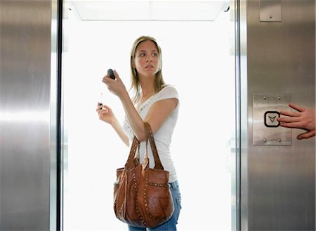 Girl in lift Fotografie stock - Premium Royalty-Free, Codice: 649-02665998