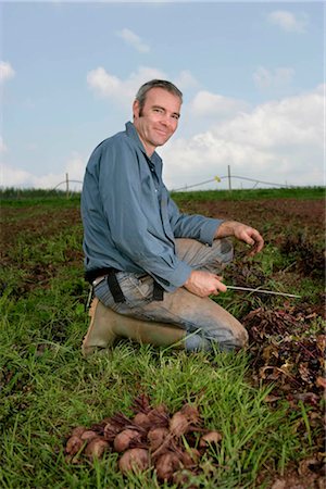 farmer sitting on the fence - portrait farm worker Stock Photo - Premium Royalty-Free, Code: 649-02666053