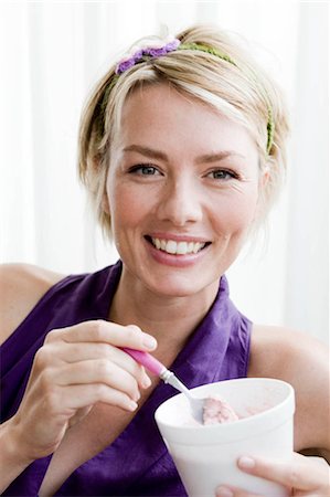 Woman eating ice cream Stock Photo - Premium Royalty-Free, Code: 649-02666137