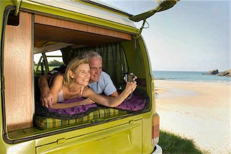 simsearch:649-02666221,k - Mature couple lying in camper van Stock Photo - Premium Royalty-Free, Code: 649-02666220