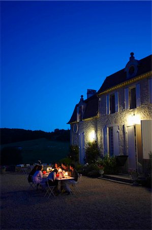 Friends having dinner outside Stock Photo - Premium Royalty-Free, Code: 649-02666442