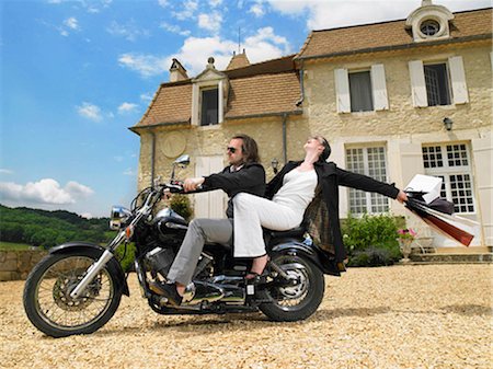 people at a mansion - Couple on motorbike Stock Photo - Premium Royalty-Free, Code: 649-02666454