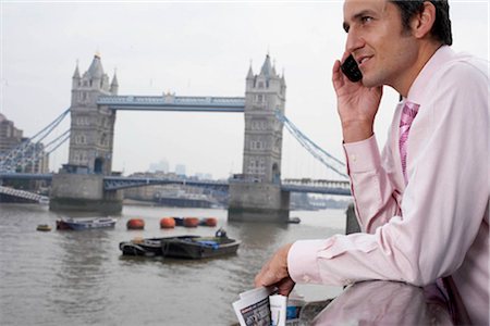 simsearch:693-03301517,k - Business man using a mobile phone Stock Photo - Premium Royalty-Free, Code: 649-02667052