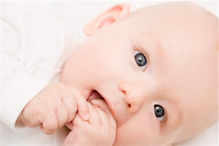 Baby smiling into camera Stock Photo - Premium Royalty-Free, Code: 649-02731333