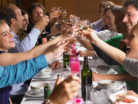 dinner party friends indoors young adults - People toasting their glasses at dinner Stock Photo - Premium Royalty-Free, Code: 649-02731605