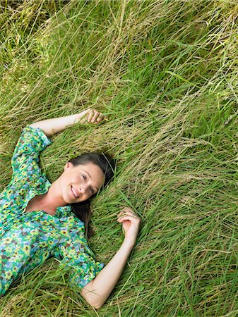simsearch:649-02732250,k - Woman laying down in a field Stock Photo - Premium Royalty-Free, Code: 649-02731687