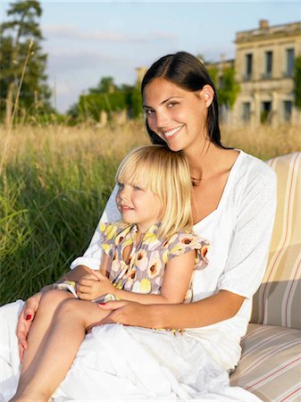 simsearch:649-02731940,k - Mother and daughter on sofa in a field Stock Photo - Premium Royalty-Free, Code: 649-02731733