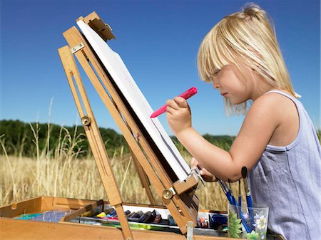 paint child drawing - Girl painting in a field Stock Photo - Premium Royalty-Free, Code: 649-02731821