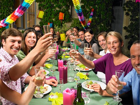 fun with black friends - People sitting at table,  celebrating Stock Photo - Premium Royalty-Free, Code: 649-02731908