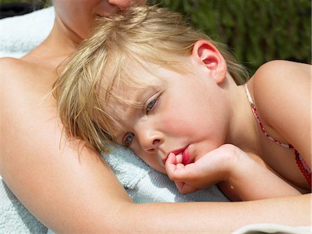 Girl resting on her mother,  heat Stock Photo - Premium Royalty-Free, Code: 649-02731926