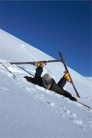 fallen on skis in snow - Male skier fallen over Stock Photo - Premium Royalty-Free, Code: 649-02732564