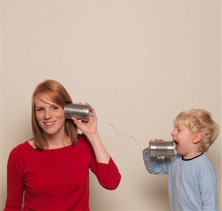 screaming babies - Mother and son playing with can phone Stock Photo - Premium Royalty-Free, Code: 649-02732649