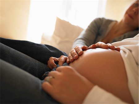 Hands touching pregnant belly Stock Photo - Premium Royalty-Free, Code: 649-02732833
