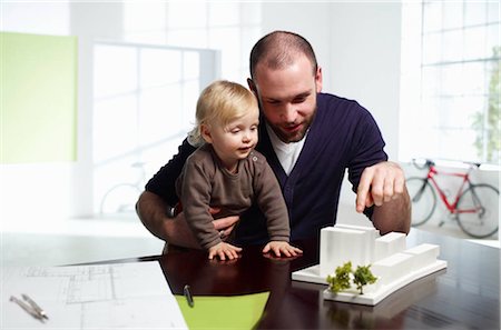 family and scale - Male architect with baby Stock Photo - Premium Royalty-Free, Code: 649-02733096