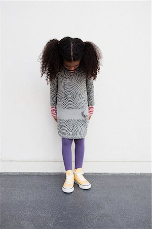 sad person african american - young girl looking down her legs Stock Photo - Premium Royalty-Free, Code: 649-03008935