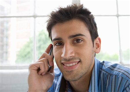 simsearch:614-08870492,k - Portrait of a man using a mobile phone. Stock Photo - Premium Royalty-Free, Code: 649-03009424