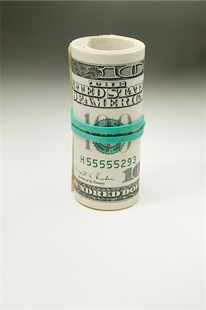 rolled money - Us One Hundred dollar bill Stock Photo - Premium Royalty-Free, Code: 649-03009588