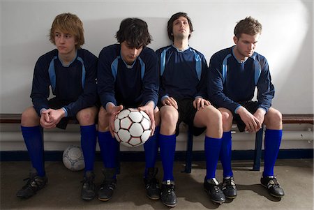 soccer player holding ball - footballers in a changing room Stock Photo - Premium Royalty-Free, Code: 649-03009817