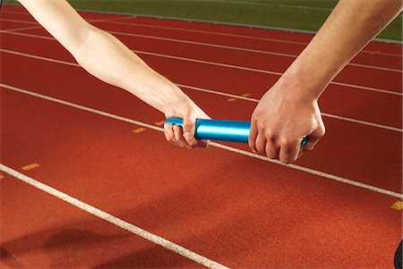 relay race competition - relay baton being exchanged Stock Photo - Premium Royalty-Free, Code: 649-03009837