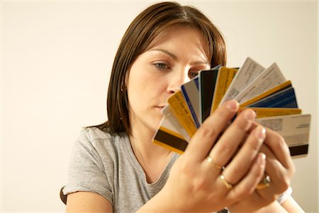 frustrated shopper - woman with credit cards Stock Photo - Premium Royalty-Free, Code: 649-03009858