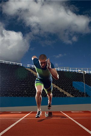 pic of a track and field start - athlete out of blocks Stock Photo - Premium Royalty-Free, Code: 649-03009870