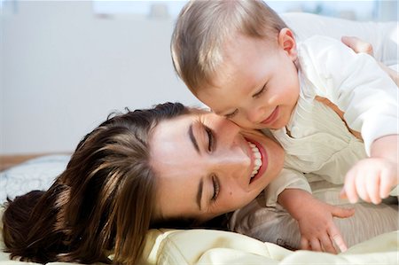 simsearch:649-06717451,k - Mother and baby cuddling and playing Stock Photo - Premium Royalty-Free, Code: 649-03010053