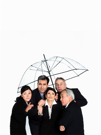 A business group under a clear umbrella Stock Photo - Premium Royalty-Free, Code: 649-03077994