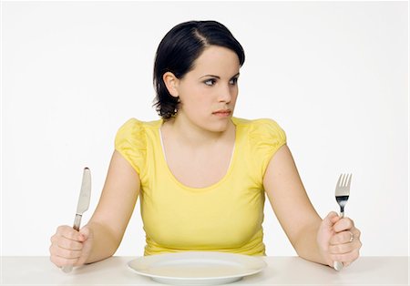 woman with empty plate Foto de stock - Sin royalties Premium, Código: 649-03078746