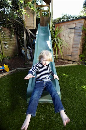 sliding - Young boy on a slide Stock Photo - Premium Royalty-Free, Code: 649-03154187