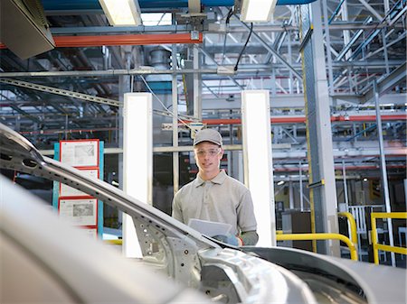 quality assurance - Car Plant Worker With Car Stock Photo - Premium Royalty-Free, Code: 649-03154450