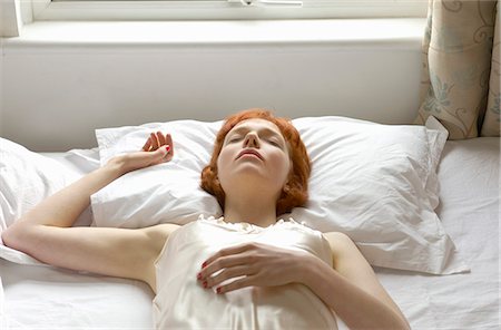 woman asleep on bed Stock Photo - Premium Royalty-Free, Code: 649-03154825