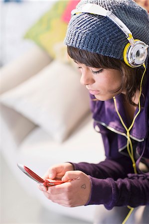 Girl with headphones and cell-phone Stock Photo - Premium Royalty-Free, Code: 649-03153530