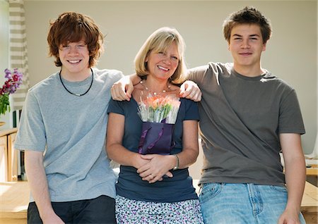 simsearch:700-02757203,k - Sons standing with arms around mother Stock Photo - Premium Royalty-Free, Code: 649-03153824